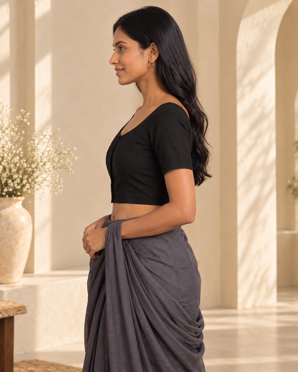 Classic black front-hook saree blouse in cotton, side profile view with grey saree draped over the shoulder