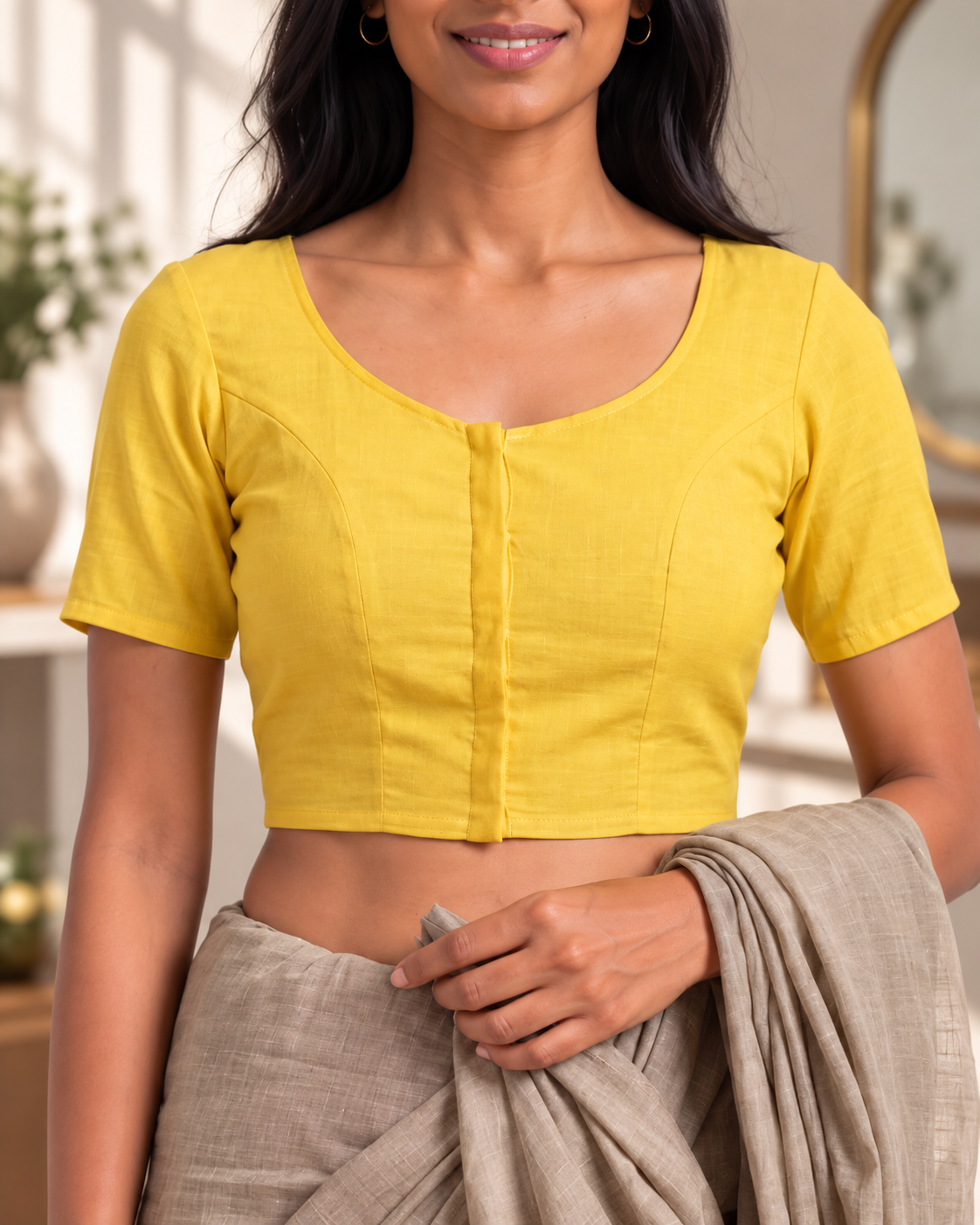 Sunshine yellow front-hook saree blouse in cotton, close-up of scoop neckline and button placket